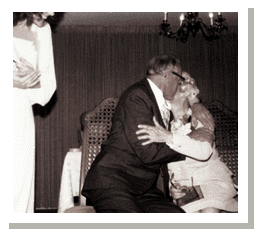 Anna Bella & Piano Man Sam kiss at 50th Wedding Anniversary