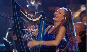 Deborah Henson-Conant playing her electric harp in a live show