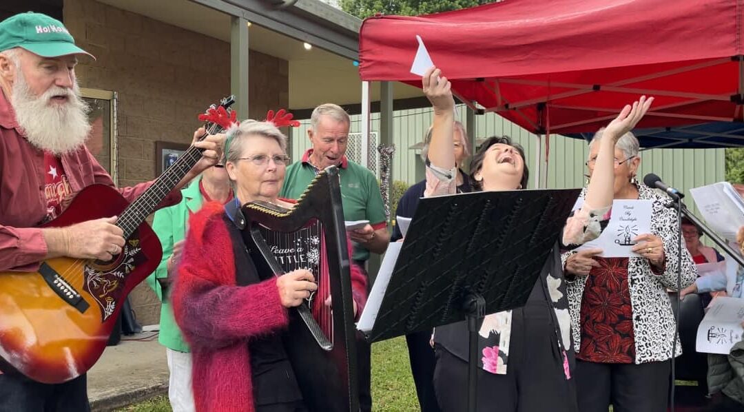 It takes a Harpist: Carol Booth saves the first post-pandemic Holiday Carol Sing in Lorne, New South Wales